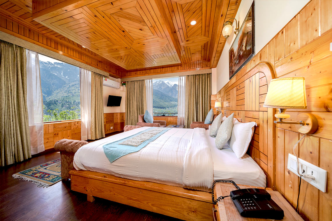 Family cottage balcony Himalayan view Manali